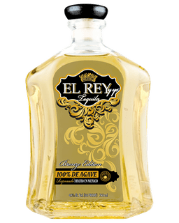 Image of a bottle of El Rey Tequila, featuring a sleek design with a dark gold label and lighter gold accents.