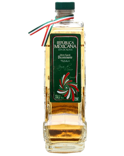 Image of a bottle of Joyas de Mexico Reposado Tequila, featuring a bottle design in the shape of the Mexican territory with a dark green label with red, white, and green accents.