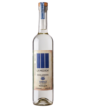 Image of a bottle of La Medida Tobala Mezcal featuring a sleek design with an aged label and blue accents.