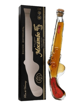 Image of a bottle of Mocambo Musket Rum featuring a pistol design next to its black box with gold accents.