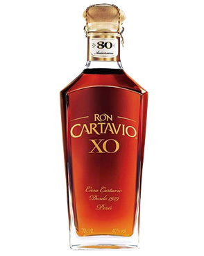 Image of a bottle of Ron Cartavio XO Rum featuring a sleek design with a clear label and gold accents.