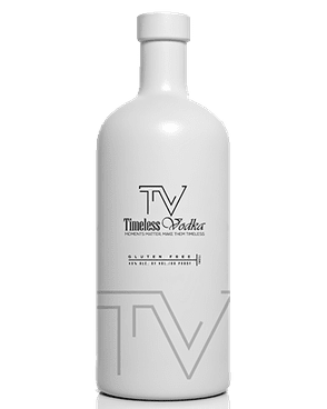 Image of a white bottle of Timeless Vodka featuring a sleek design with a clear label and black accents.