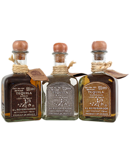 Image of a 3 bottles of El Reformador Tequila, blanco, reposado, and anejo, featuring a sleek design with brown, silver and bronze labels respectively and white accents.