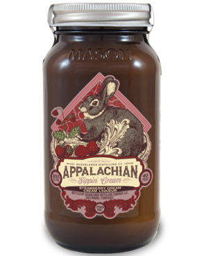 Image of a jar of Sugarlands Appalachian Strawberry Dream Sippin' Cream Liqueur featuring a sleek design with a red label with a rabbit and white accents.