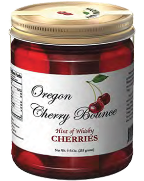 Image of a jar of Oregon Cherry Bounce with a white label and black and red accents.